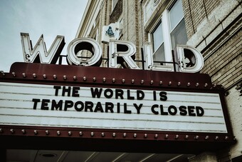 A theatre marquis reading The World is Temporarily Closed.