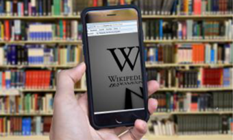 A phone opened to a Wikipedia page.