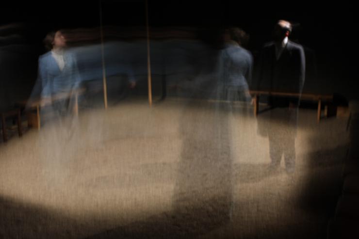blurred figures on stage