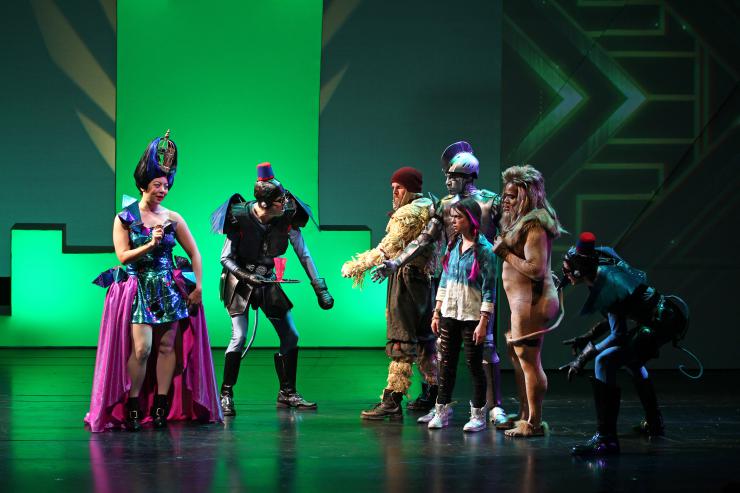 a group of actors in elaborate costumes on stage