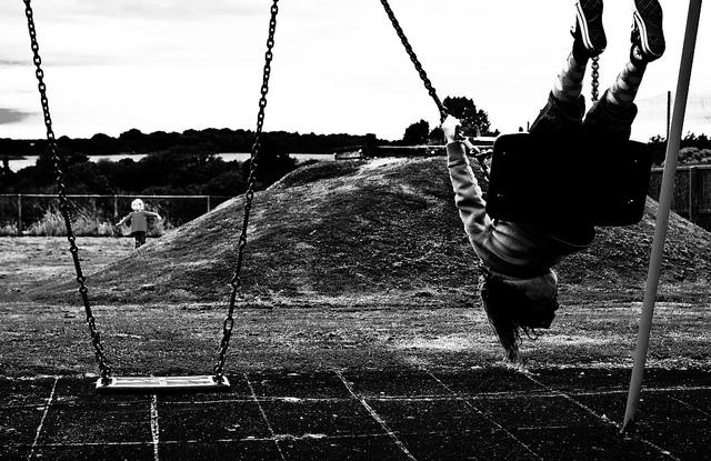 child on swing set