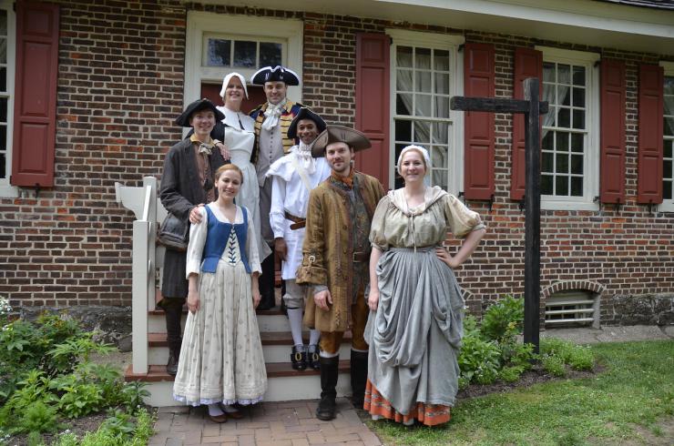 a group of people in colonial wear