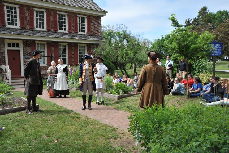 actors in period costume performing outside