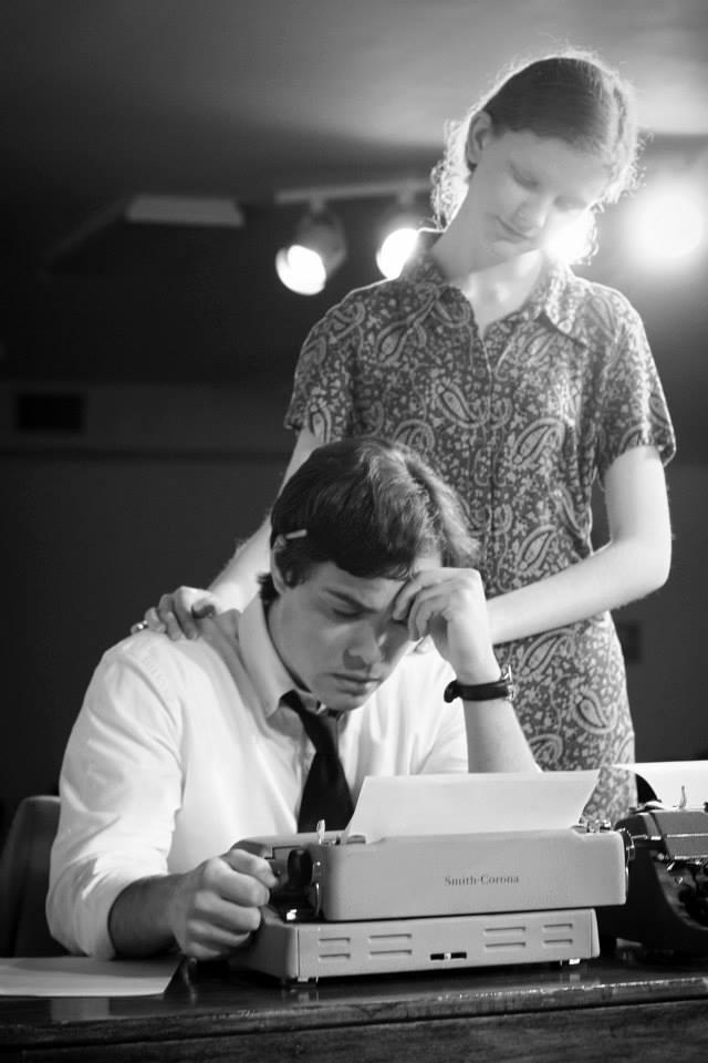 an actor and an actress at a typewriter