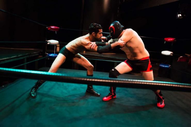 Two men wrestling 