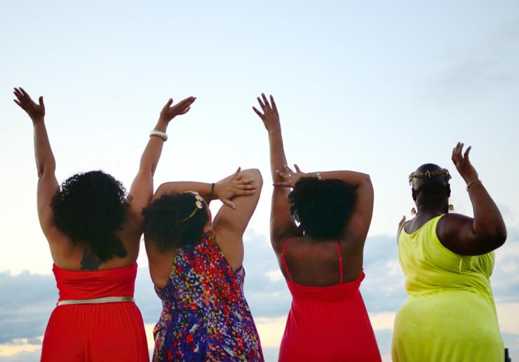 four women dancing