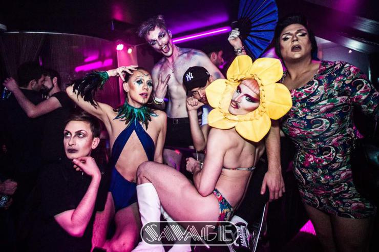 a group in a club wearing drag