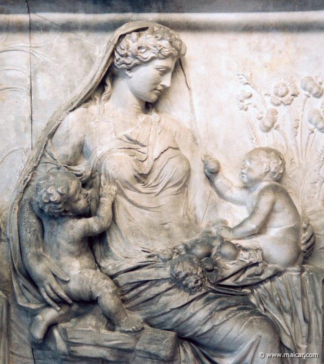 marble statue of a woman holding babies