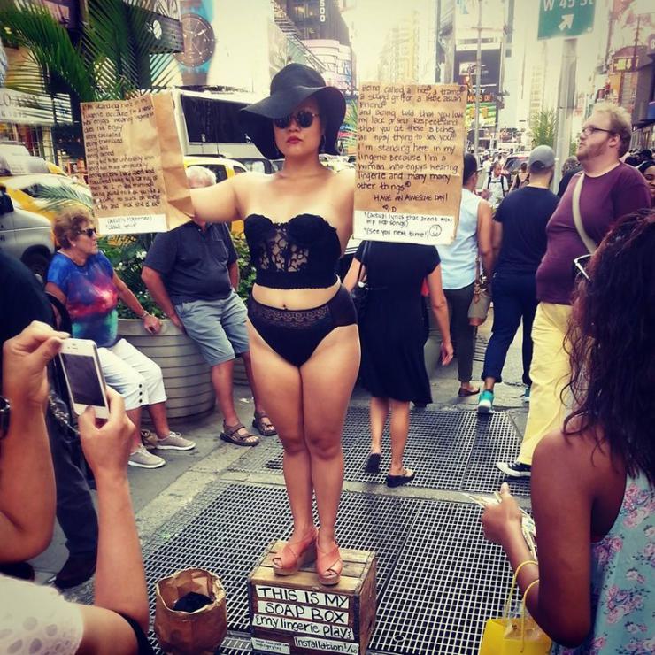 a woman standing on a soapbox 