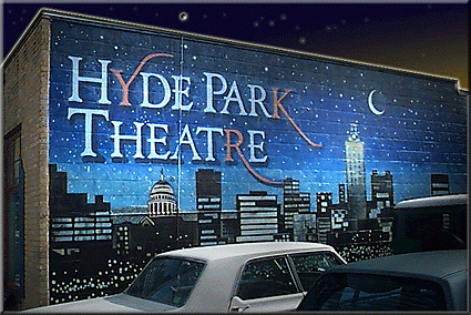 A mural of the Austin skyline painted on the side of the Hyde Park Theater.