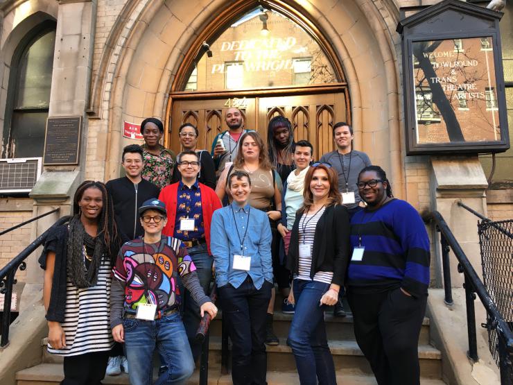 14 trans artists posing for a picture on the steps of New Dramatists.