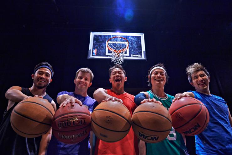 actors on stage with basketballs 