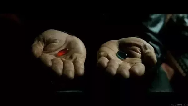 Man holding two pills 