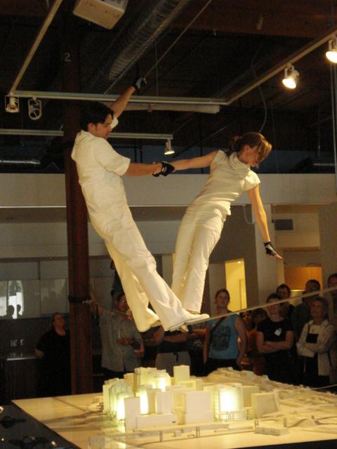 two actors on a wire on stage 