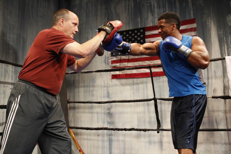 Two actors in a boxing ring 