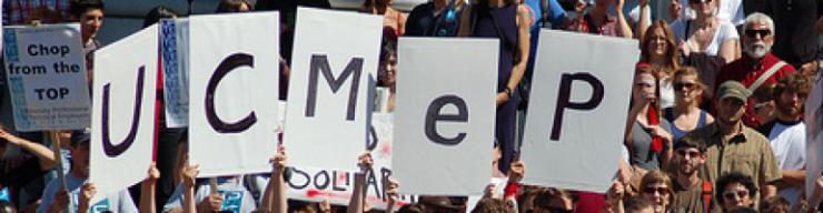 Protest posters reading "UCMEP"