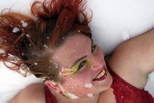 A performer lying in snow 