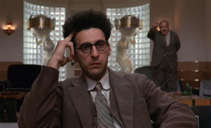 The character Barton Fink scratches his head.