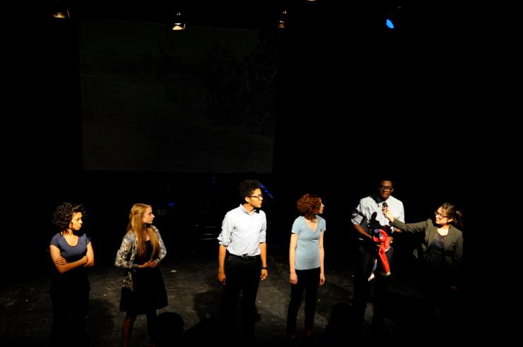 Young actors on stage in a line