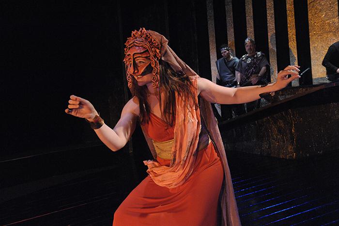 an actor in a mask on stage 