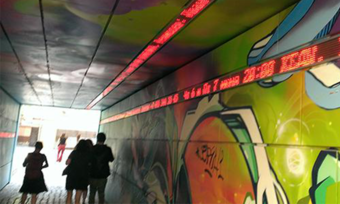 A tunnel covered in graffiti.