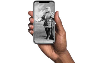 hand holding a cell phone screen depicting a classical painting
