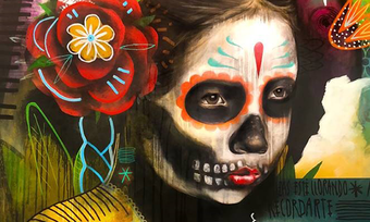 a painting of a girl in Mexican "day of the dead" skull makeup.