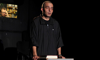 actor in black shirt on stage