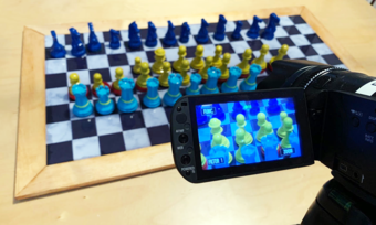 a chess board being video recorded