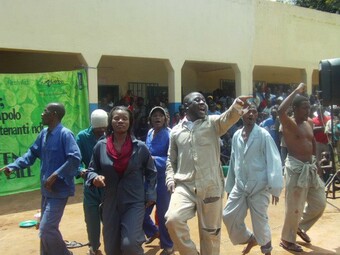 Image of group of people marching in streets in Malawi