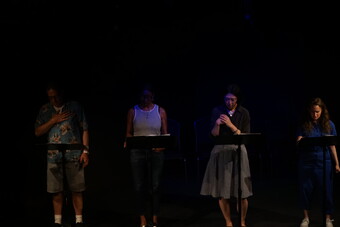 Actors performing a stage reading.