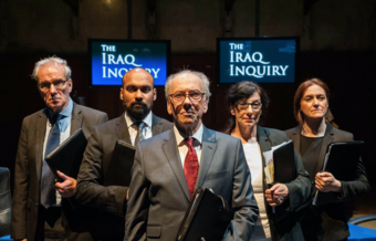 Five actors in suits stand in front of TVs reading The Iraq Inquiry