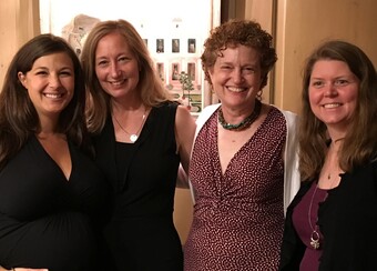 A group of ladies posing for a photo. 