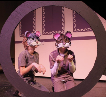 Two children dressed as mice.