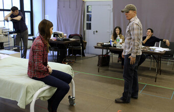 Actors rehearse for a play.