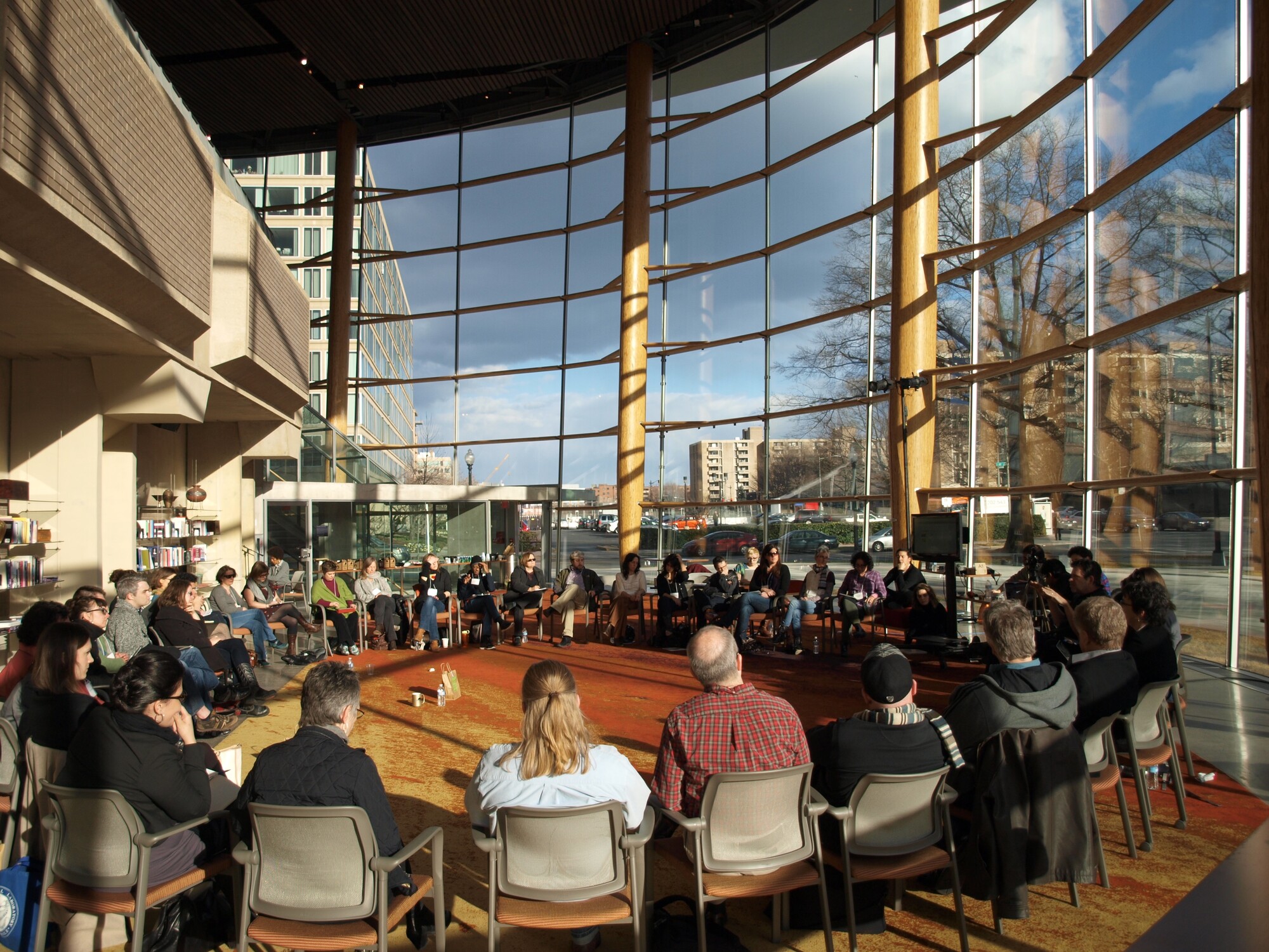 Convening attendees sit in a circle