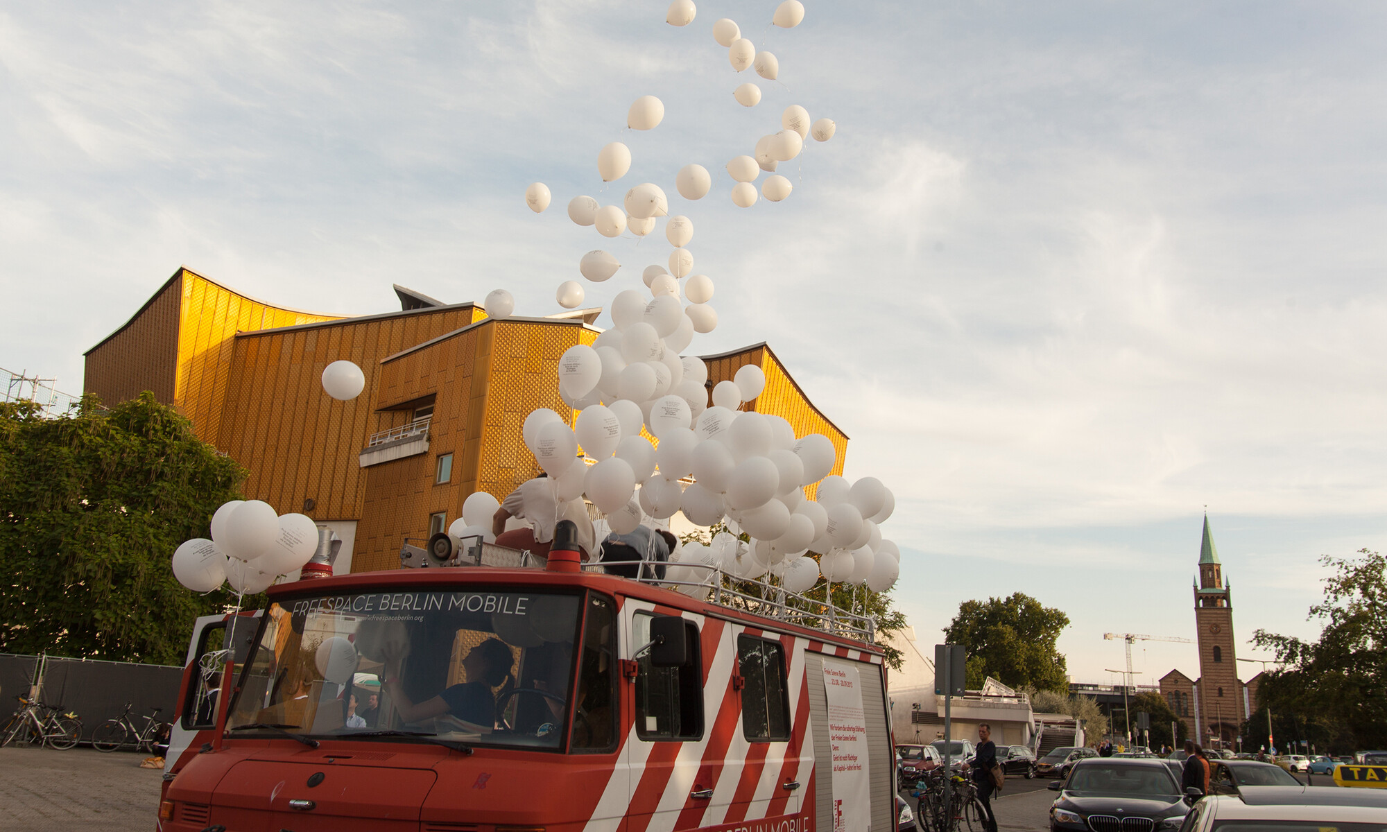 balloons flying out of the van of a roof