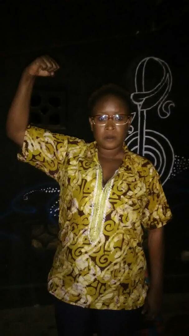 Malawi actress holding up a fist