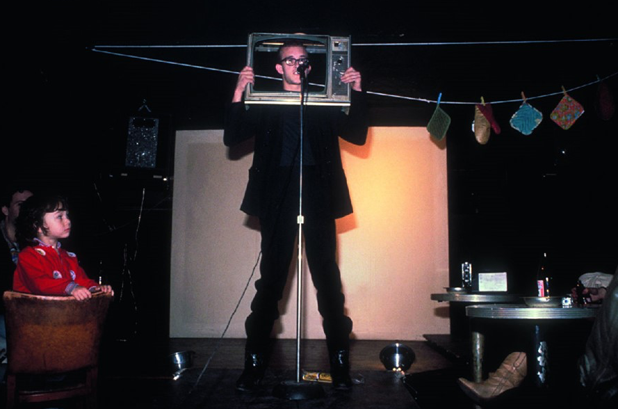 a man holding a TV frame on his head