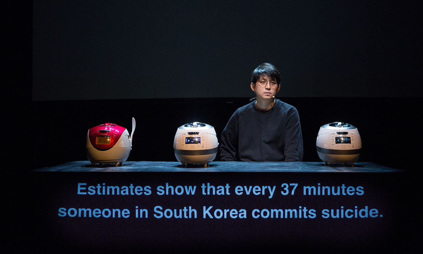 an actor onstage with the text "estimates show that every 37 minutes someone in south korea commits suicide"
