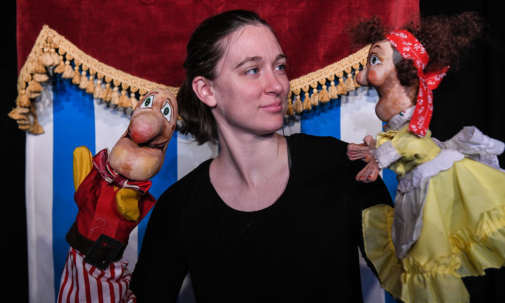an actor with two hand puppets