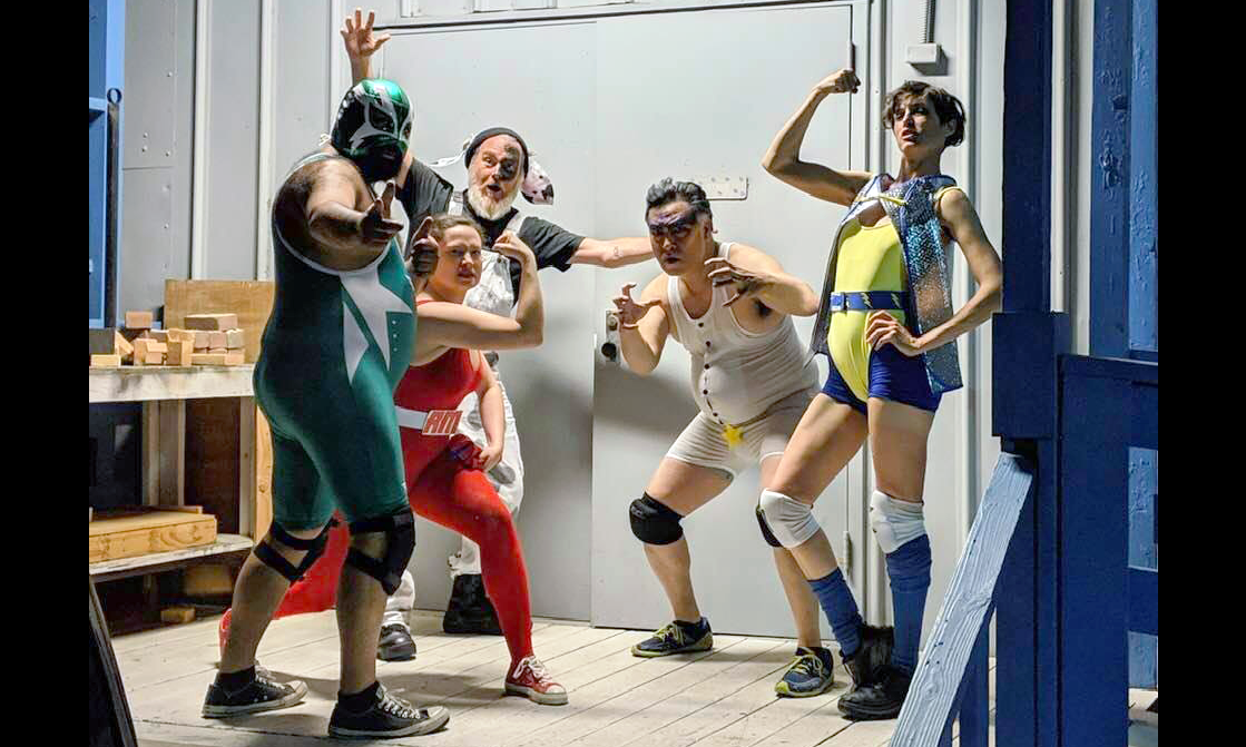 five actors dressed as wrestlers