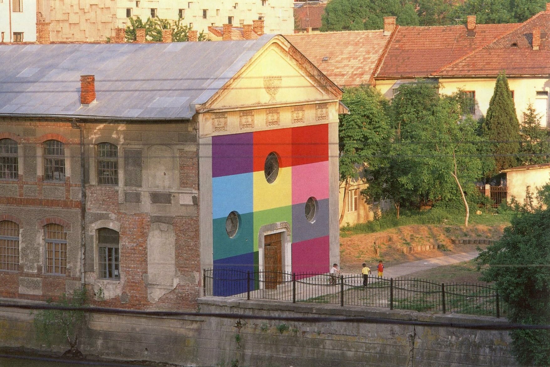 Tranzit House exterior with a colorful mural painted on the front entrance.