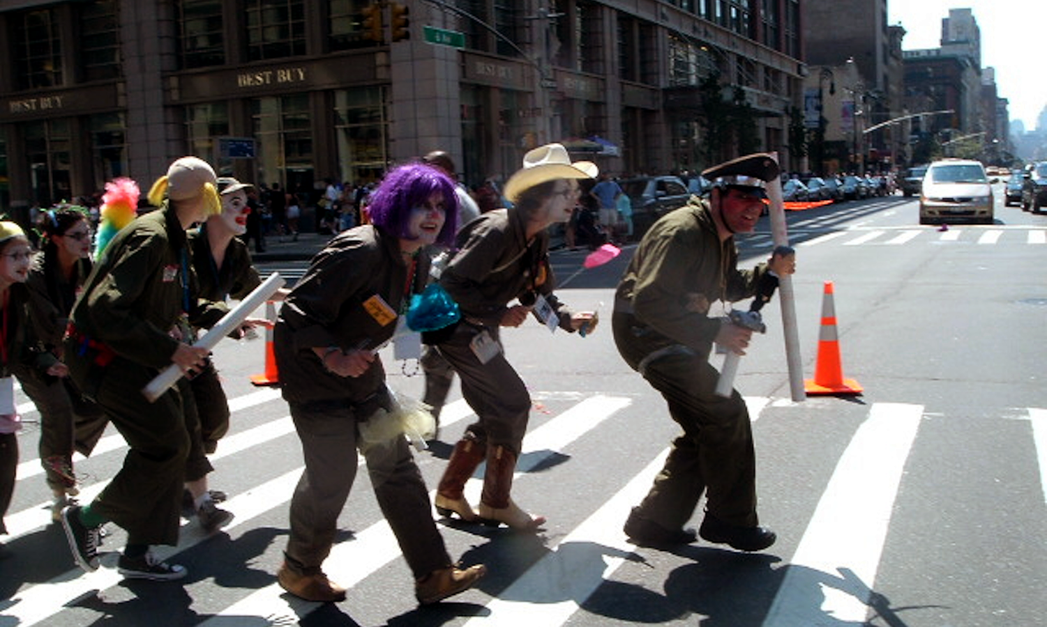 a group of clowns crossing a street