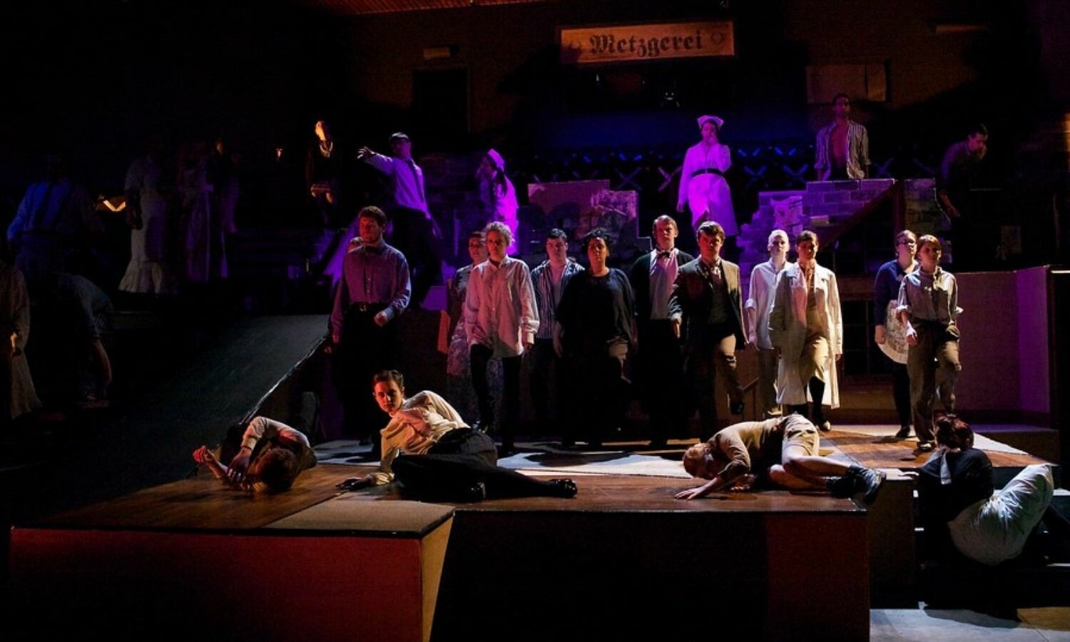 Several actors as prisoners, civilians, doctors and nurses in Bertolt Brecht's Fear and Misery of the Third Reich.