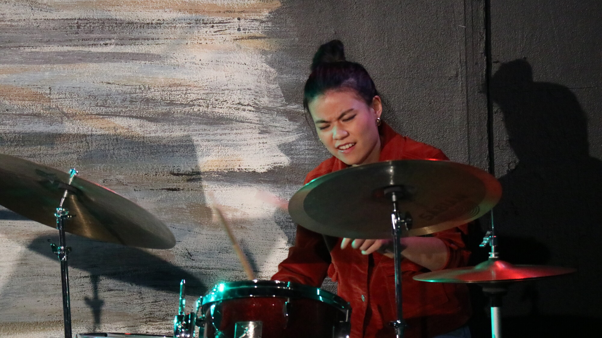 Performer playing the drums.