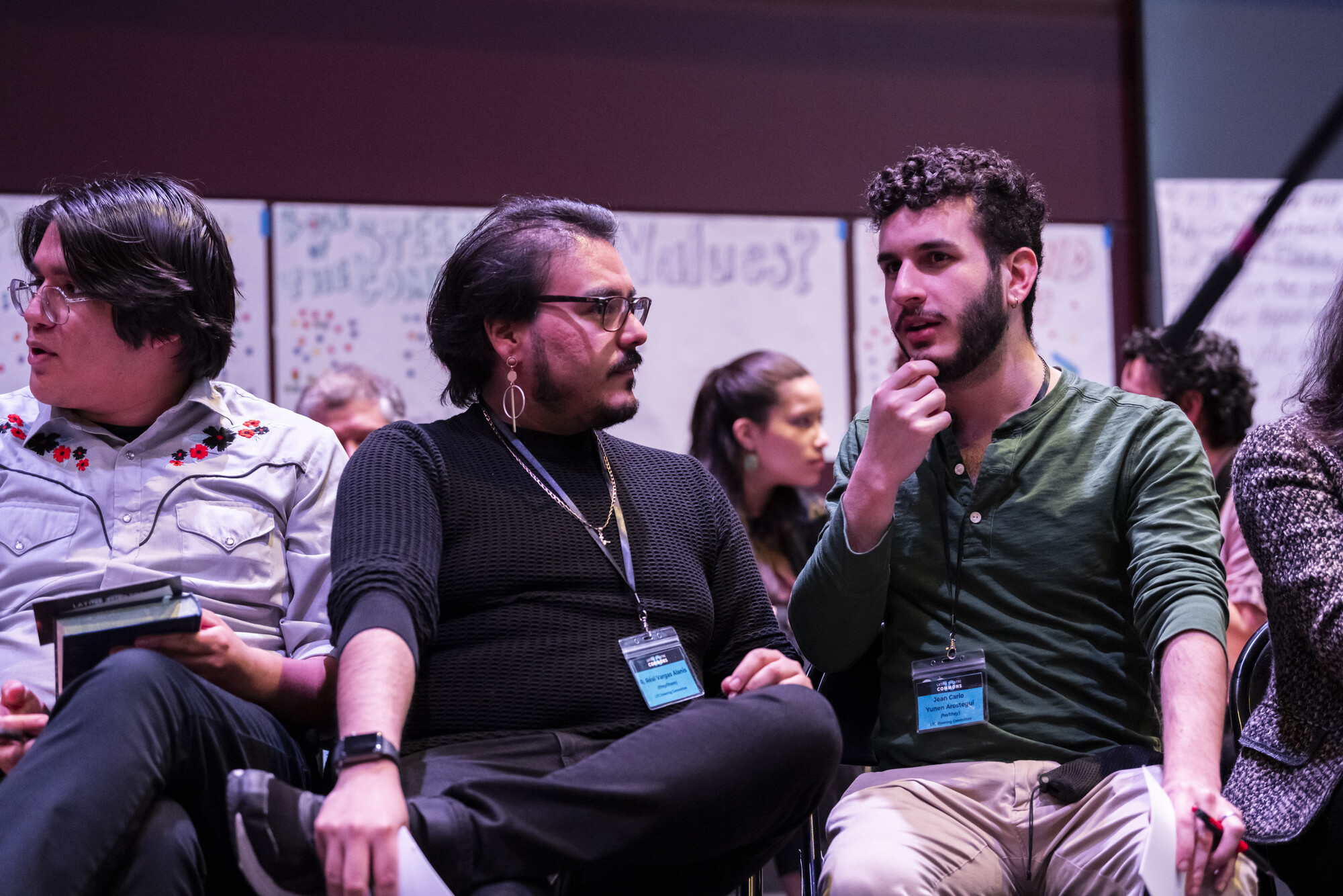 Two convening attendees have a discussion.