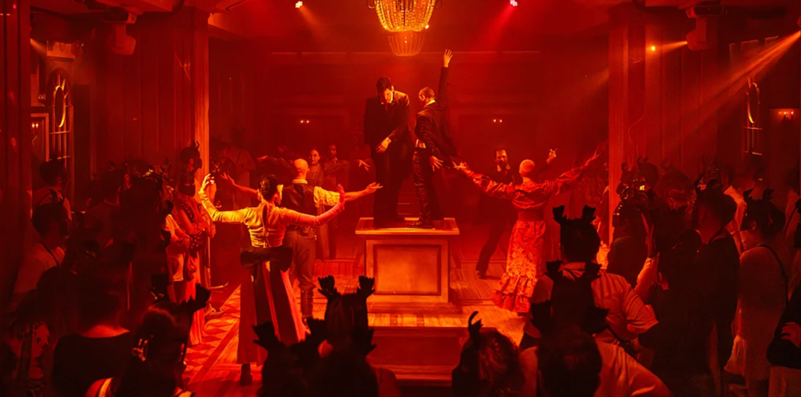 A group of people dance on stage. 
