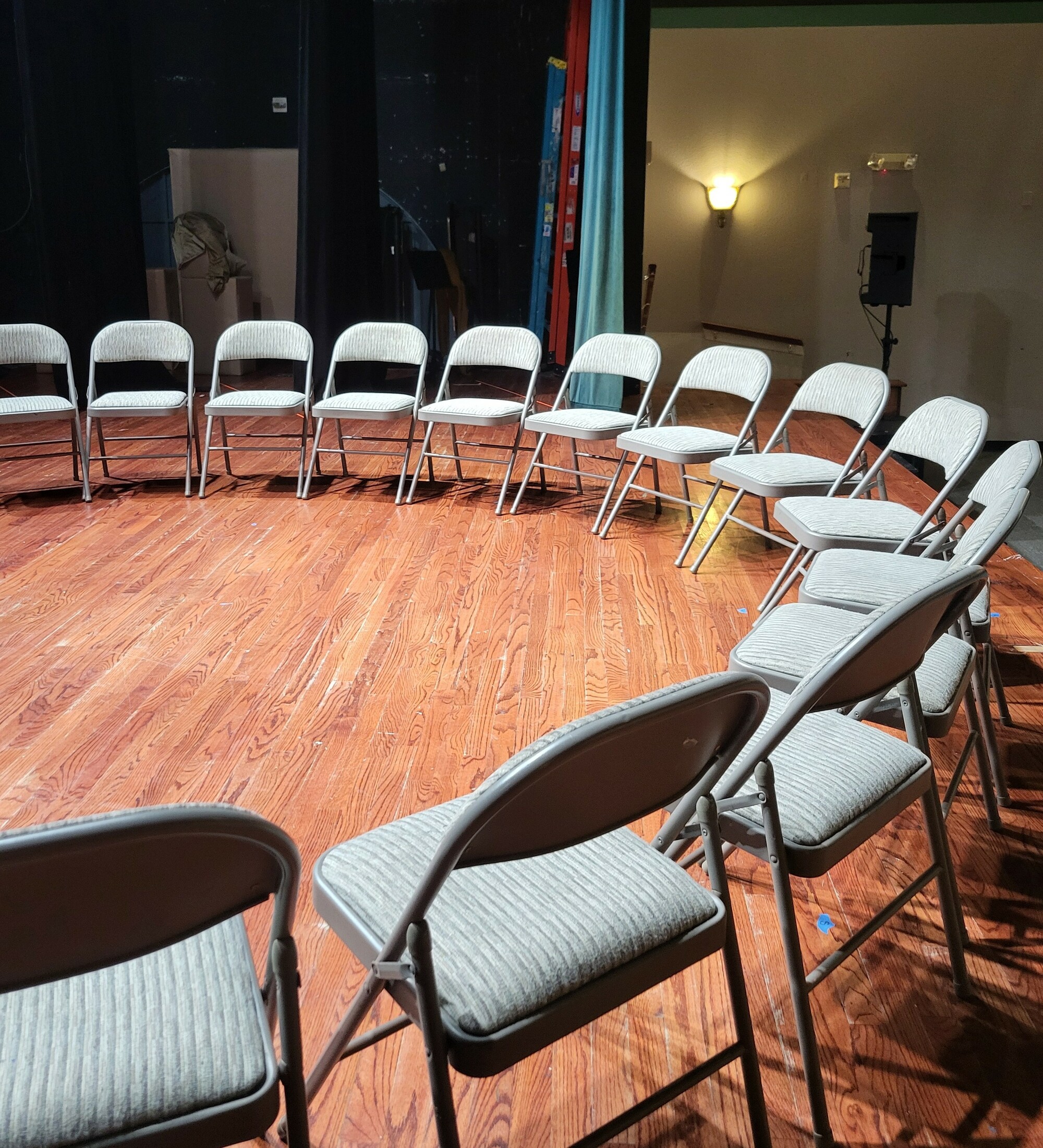 A circle of folding chairs.