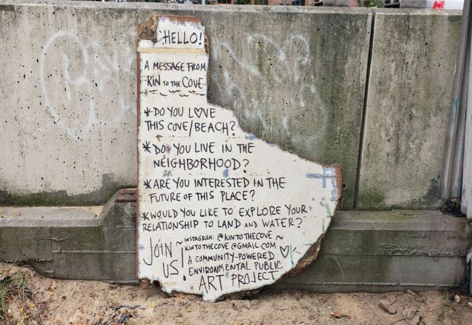 A piece of wood with a message written on it. 